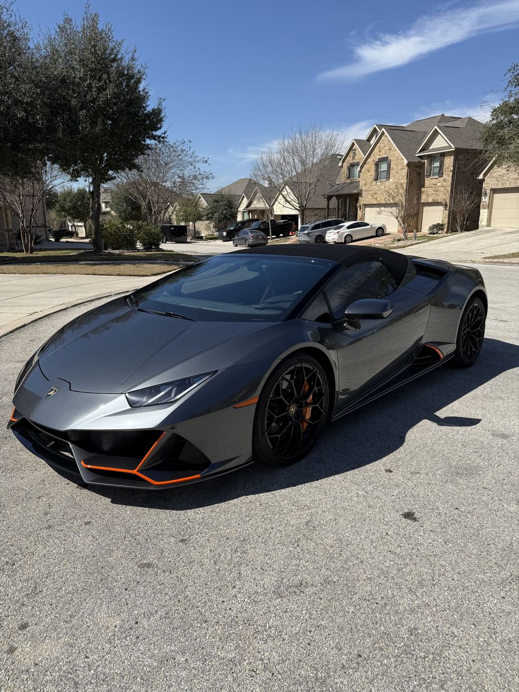 Gray Lamborghini Huracan Evo Spyder, three-quarter view with tinted windows